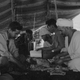 Members of the Algerian National Liberation Front meet in a tent to plan strategy, 1957